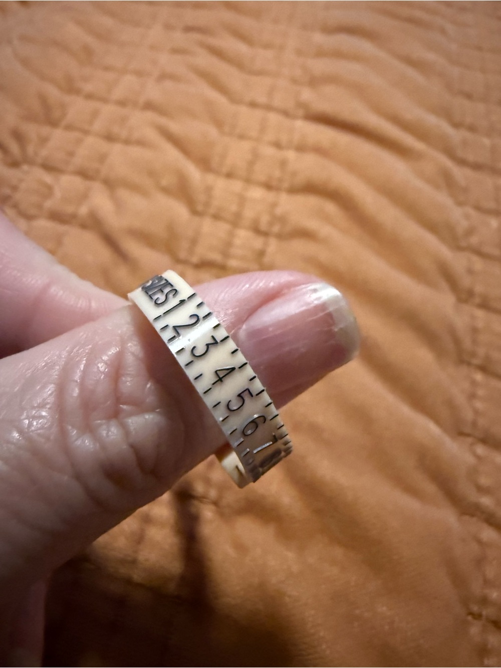 Adjustable Measuring Tape Ring Sizer in Cream with Black Numbers